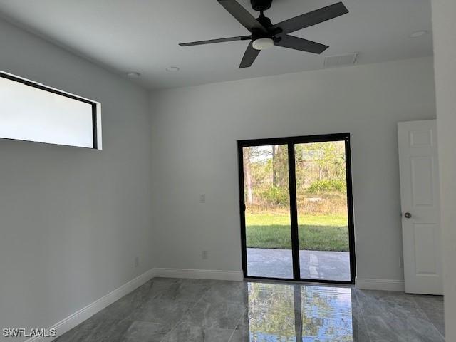 unfurnished room featuring ceiling fan