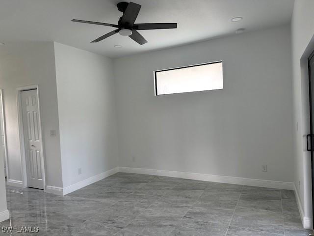 spare room featuring ceiling fan