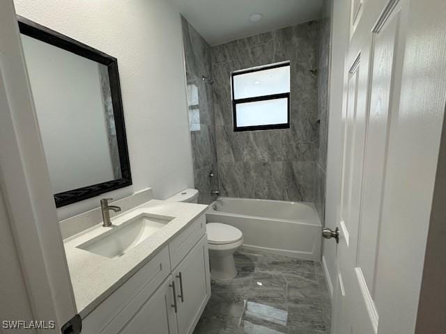 full bathroom featuring vanity, toilet, and tiled shower / bath