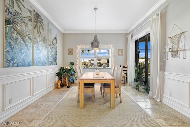 dining space with crown molding