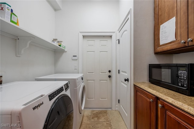 laundry area with cabinets and independent washer and dryer