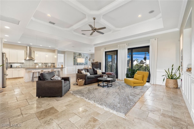 living room with crown molding, ceiling fan, and coffered ceiling