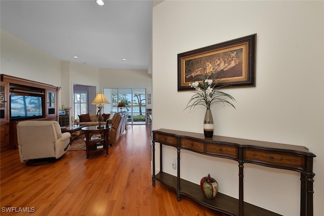 living area with recessed lighting and light wood-type flooring