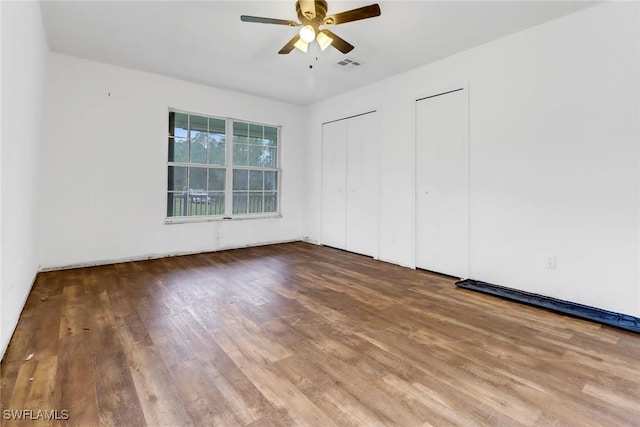 empty room featuring ceiling fan and wood-type flooring