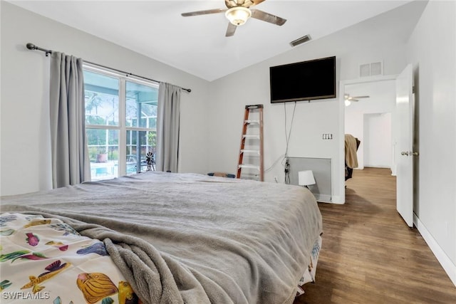 bedroom with vaulted ceiling, dark hardwood / wood-style floors, and ceiling fan