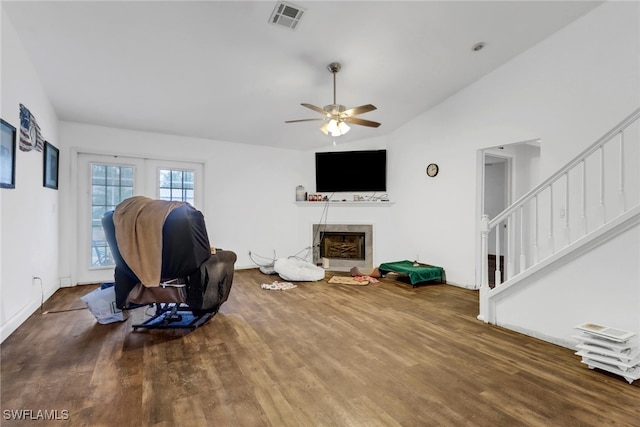 living room featuring vaulted ceiling, hardwood / wood-style floors, and ceiling fan