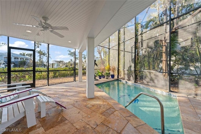 pool with a patio area, a lanai, and a ceiling fan