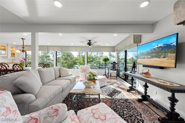 living area with ceiling fan and recessed lighting