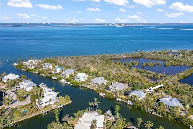 drone / aerial view featuring a water view and a residential view