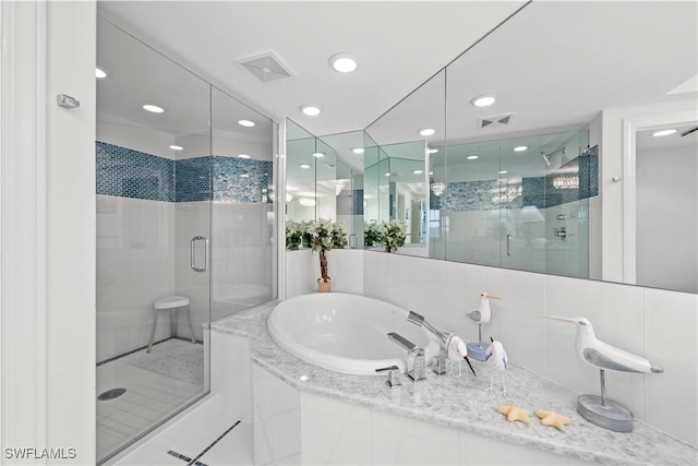 bathroom featuring separate shower and tub and tile patterned flooring