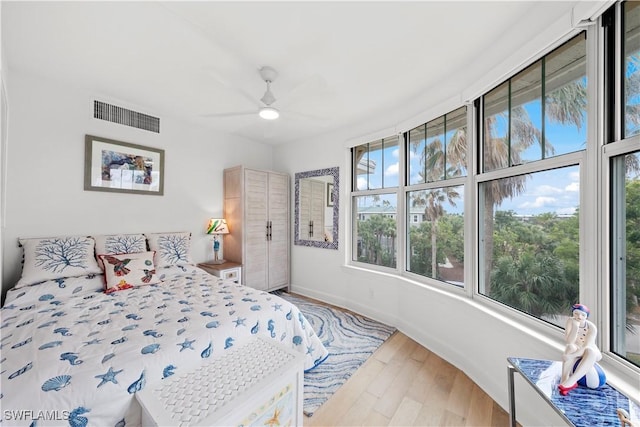 bedroom featuring hardwood / wood-style flooring and ceiling fan