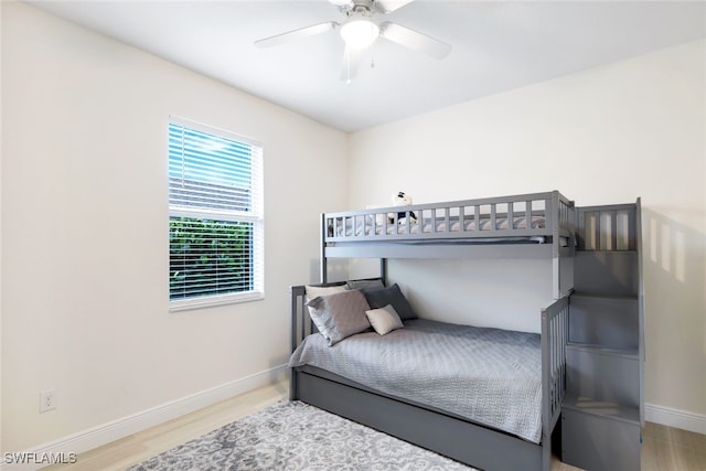 bedroom with hardwood / wood-style flooring and ceiling fan