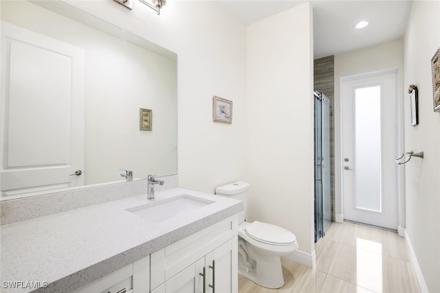 bathroom with vanity, an enclosed shower, tile patterned floors, and toilet