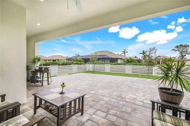 view of patio featuring ceiling fan