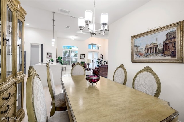 dining space with a notable chandelier