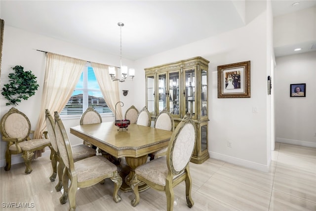 dining space featuring an inviting chandelier and light tile patterned floors