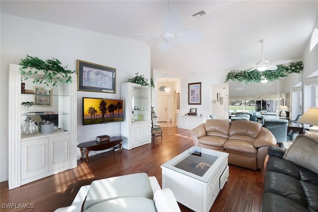 living room with ceiling fan, dark hardwood / wood-style floors, and vaulted ceiling