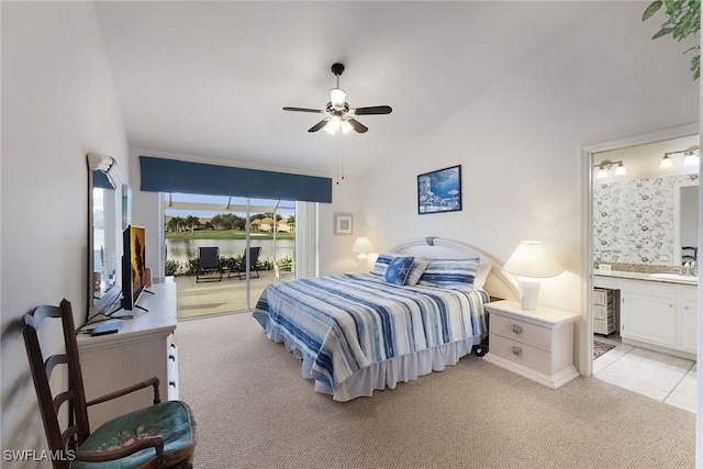 bedroom featuring sink, ceiling fan, light colored carpet, and ensuite bath