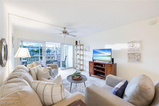 carpeted living room featuring ceiling fan