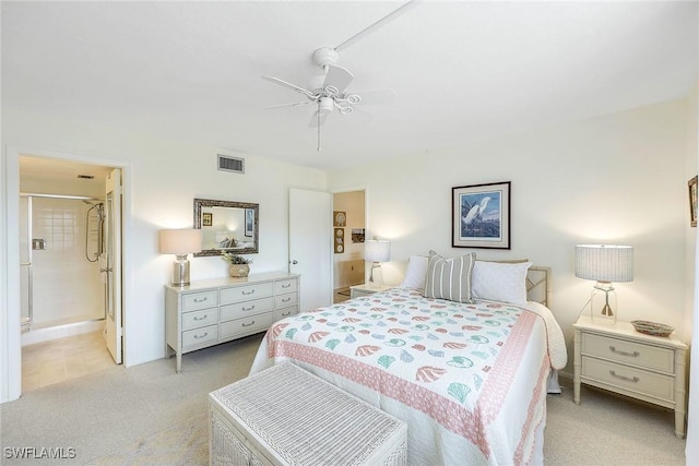 carpeted bedroom with ceiling fan and ensuite bathroom