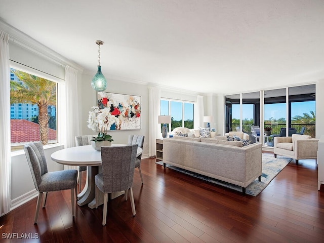 7425 Pelican Bay Blvd Unit 301, Naples, FL 34108 - dining room with dark wood-type flooring and ornamental molding