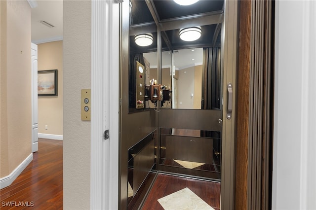 bathroom with wood-type flooring and ornamental molding