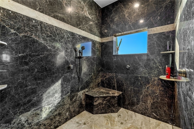 bathroom featuring a tile shower