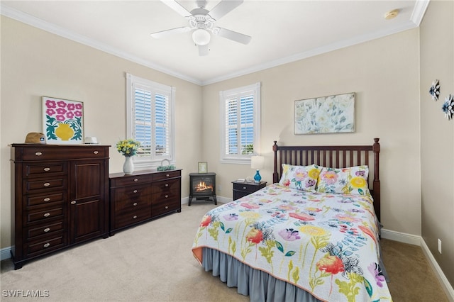 bedroom with light carpet, crown molding, and ceiling fan