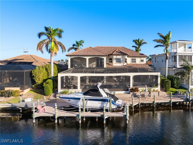 dock area featuring a balcony and a water view