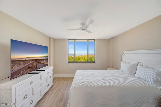 bedroom featuring ceiling fan and light hardwood / wood-style flooring