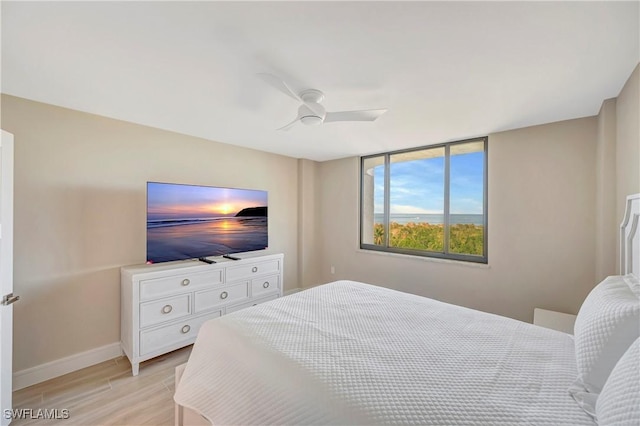 bedroom featuring ceiling fan and light hardwood / wood-style floors