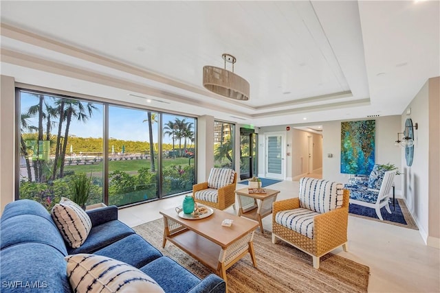 sunroom with a raised ceiling