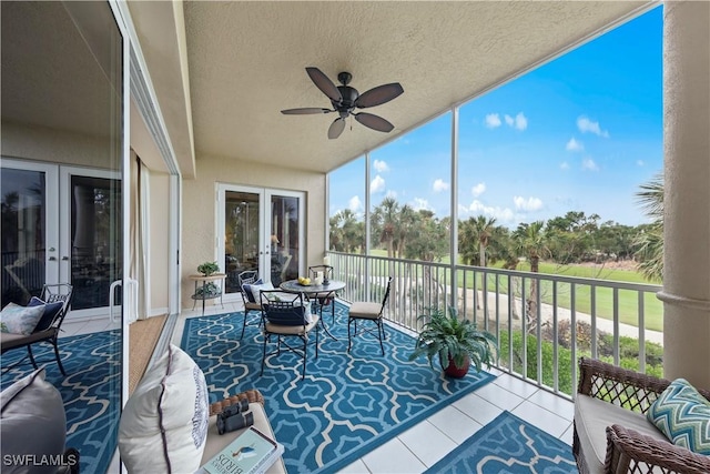 sunroom with ceiling fan and french doors