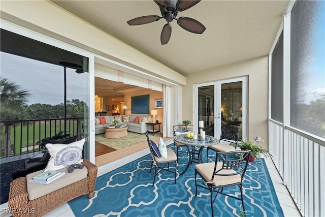 sunroom featuring a healthy amount of sunlight and french doors