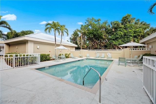 view of swimming pool with a patio area