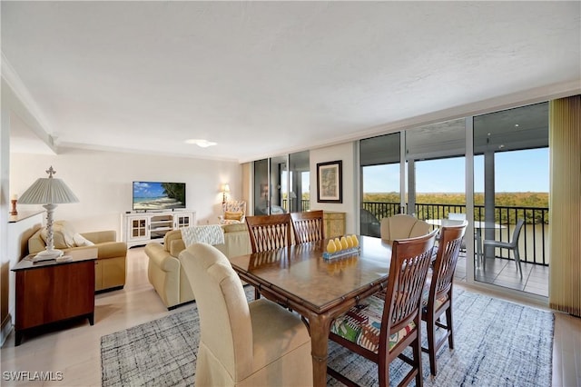 dining space with a wall of windows