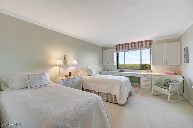 bedroom featuring light carpet, built in desk, and ornamental molding