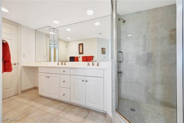 bathroom with vanity, tile patterned floors, and a shower with shower door