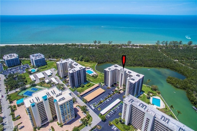 birds eye view of property with a water view