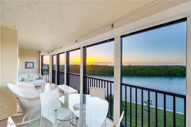 sunroom with a water view