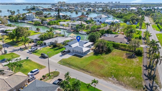 bird's eye view with a residential view and a water view