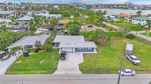 bird's eye view featuring a residential view and a water view