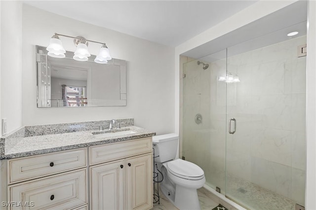 full bathroom with marble finish floor, vanity, toilet, and a shower stall