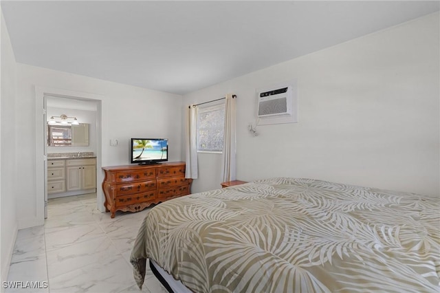 bedroom featuring marble finish floor, ensuite bathroom, and a wall mounted AC