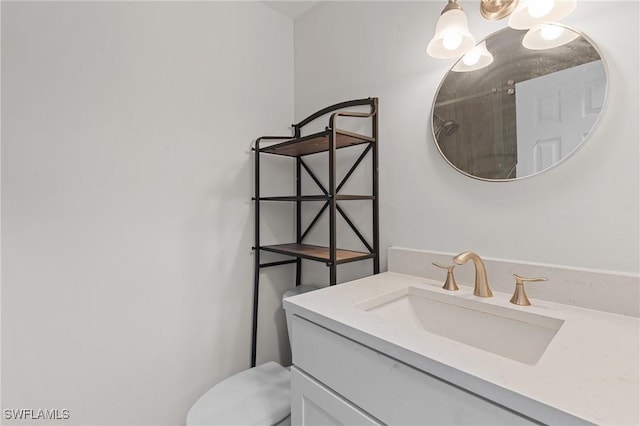 bathroom featuring toilet and vanity