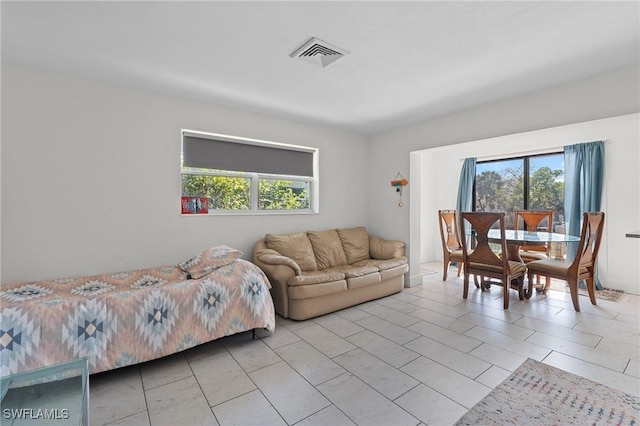 living room featuring plenty of natural light and visible vents