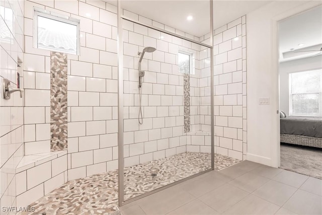 bathroom with tile patterned floors, a walk in shower, ensuite bathroom, and baseboards