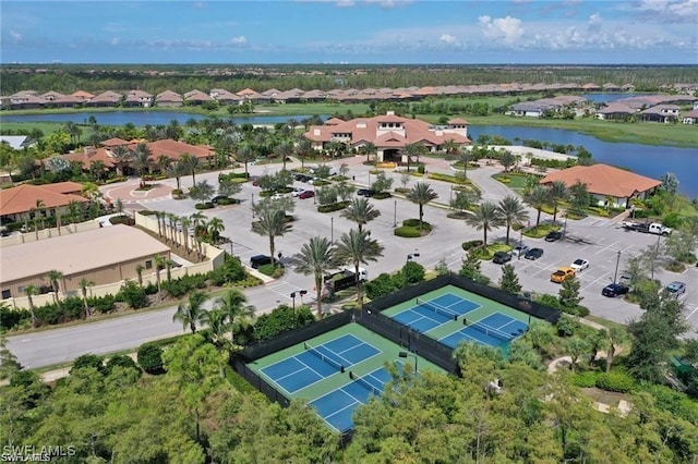 bird's eye view with a water view and a residential view