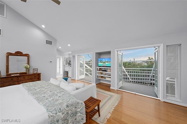 bedroom featuring hardwood / wood-style flooring, access to outside, high vaulted ceiling, and ceiling fan