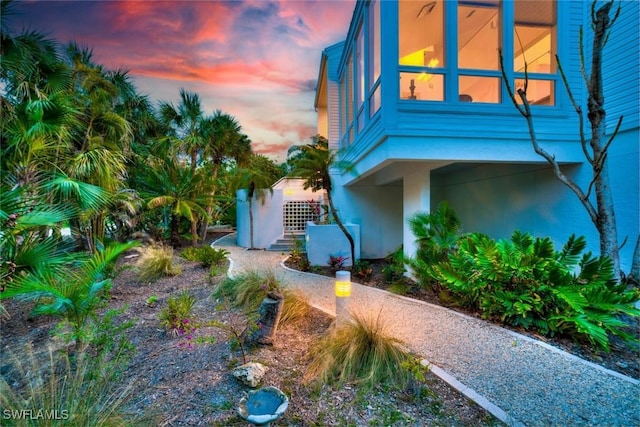 view of property exterior at dusk